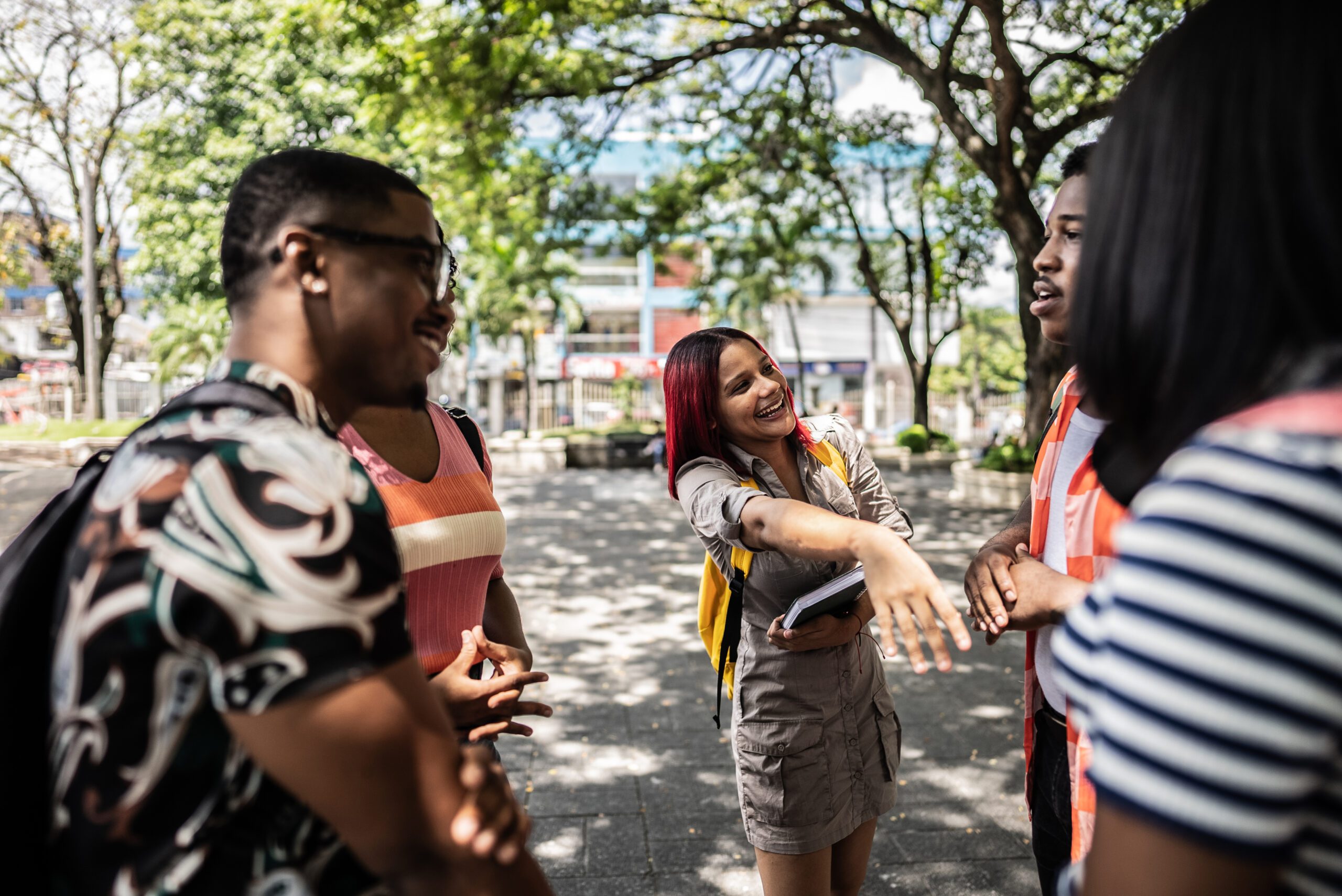 College students talking together outdoors on campus
